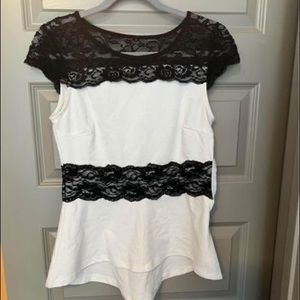Womens size small. Black and white peplum top.